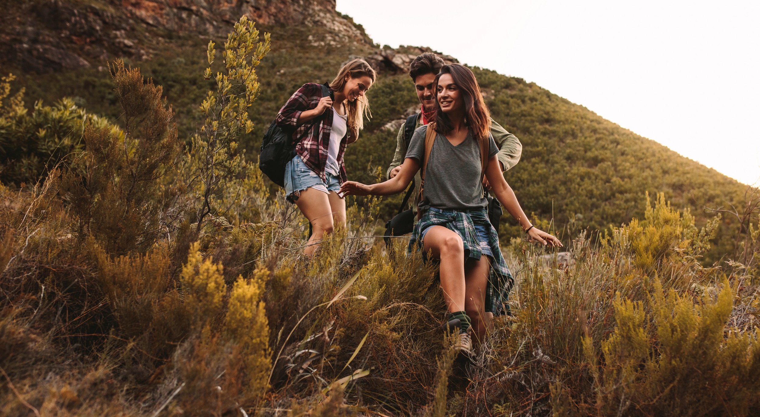 Group,Of,Friends,Walking,Through,A,Rough,Terrain.,Two,Women